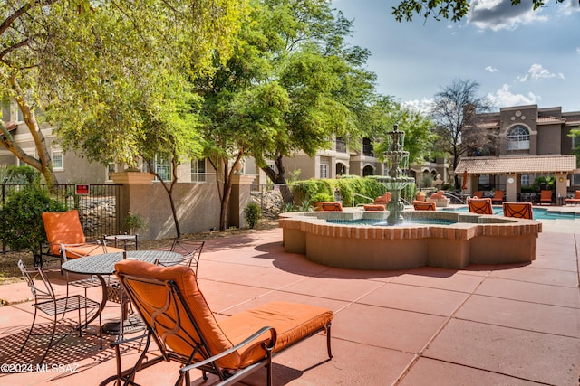 view of community with a patio