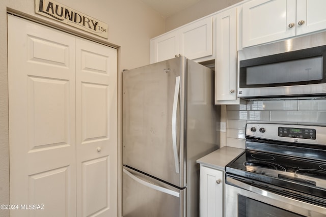 kitchen with white cabinets and stainless steel appliances