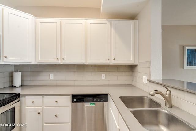 kitchen with tasteful backsplash, white cabinetry, sink, and dishwasher