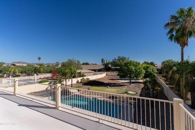 view of pool with a playground and a patio