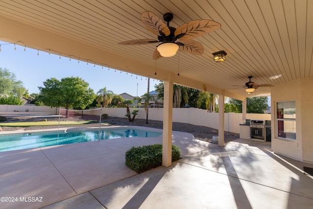 view of pool featuring ceiling fan, a grill, and a patio