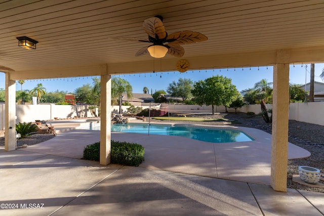 view of pool featuring ceiling fan and a patio area