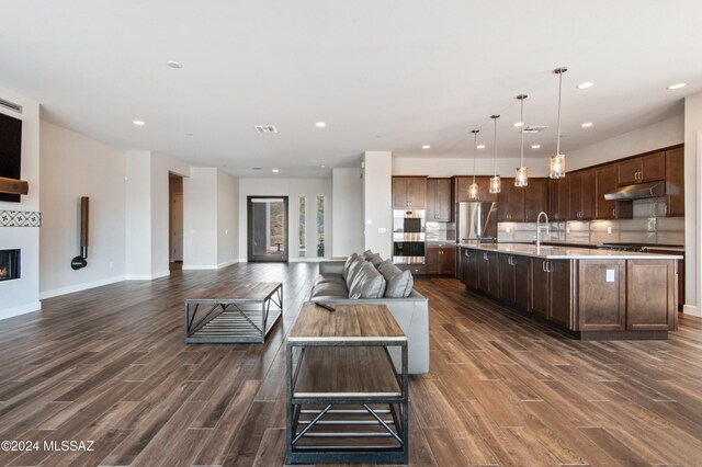 living room with sink and dark hardwood / wood-style flooring