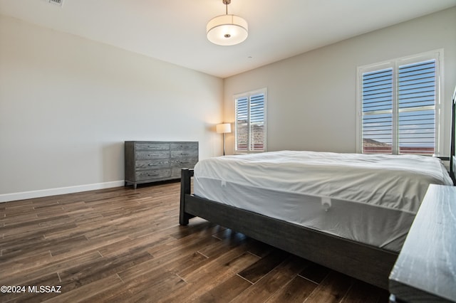 bedroom featuring dark hardwood / wood-style flooring