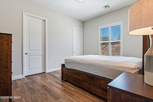 bedroom featuring dark hardwood / wood-style floors