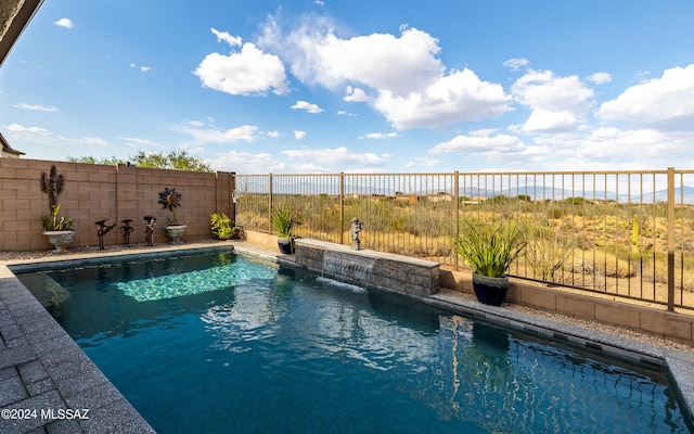 view of swimming pool featuring pool water feature