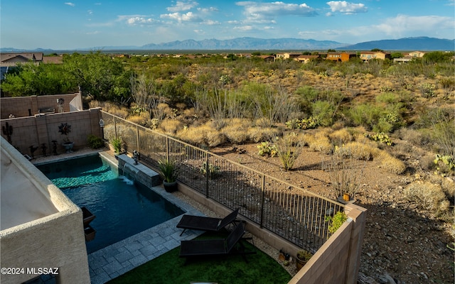 view of pool with a mountain view