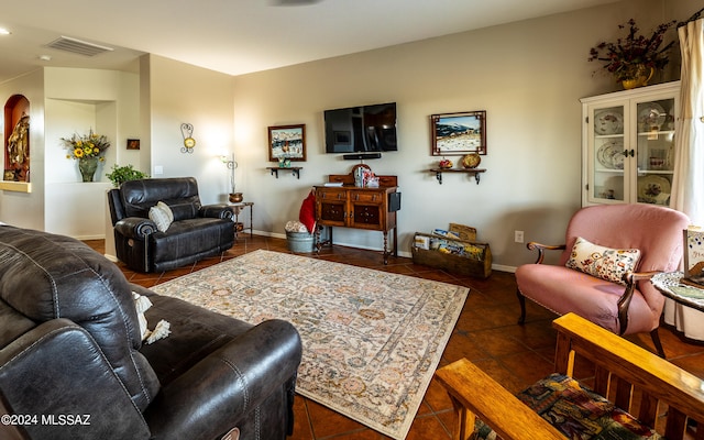 living room featuring dark tile patterned flooring