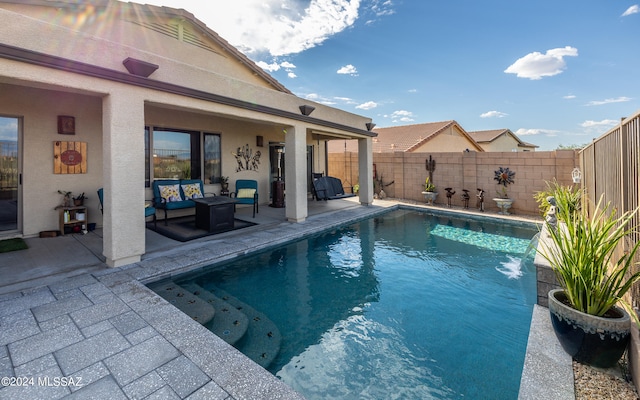 view of pool featuring a patio