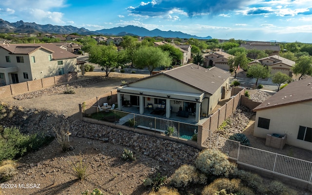 birds eye view of property featuring a mountain view