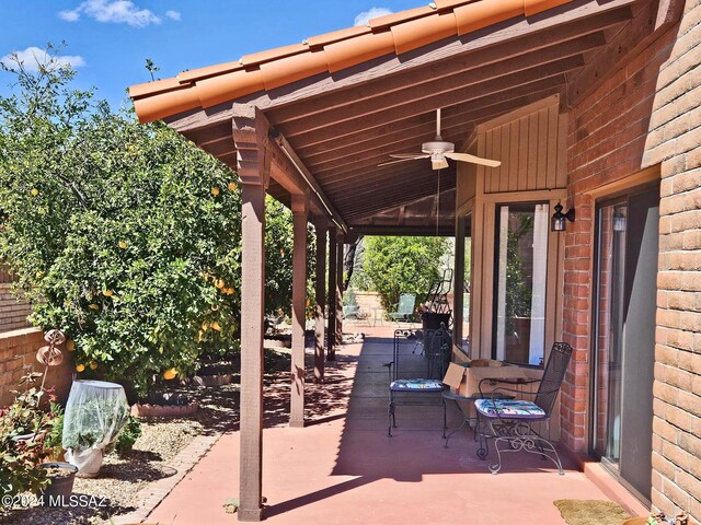 view of patio featuring ceiling fan