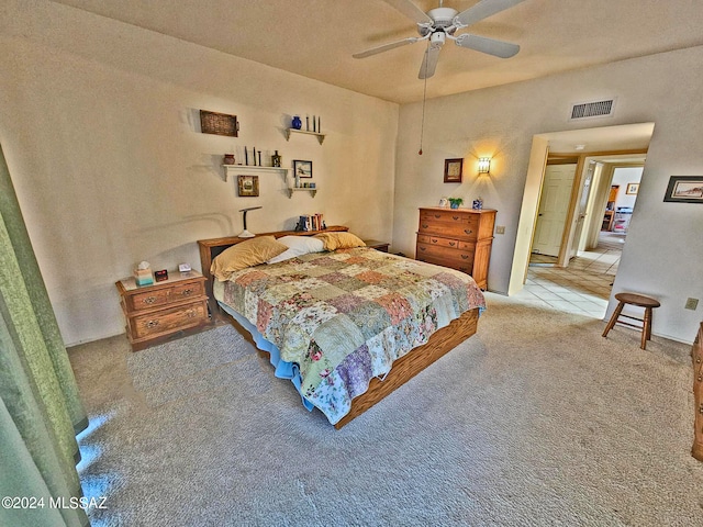 bedroom featuring ceiling fan and light colored carpet