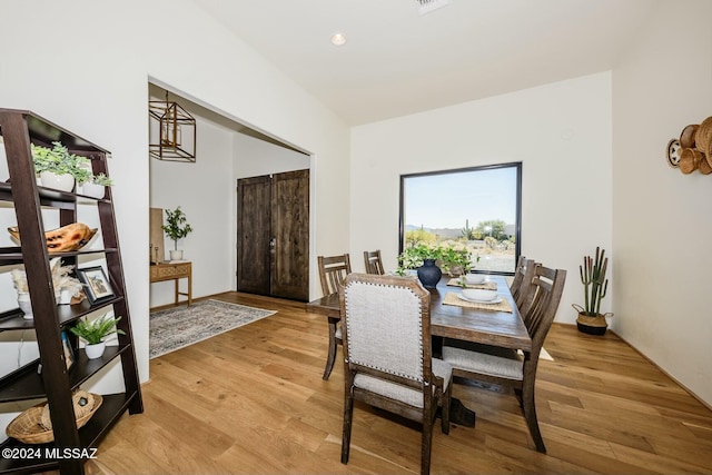 dining area with light hardwood / wood-style floors