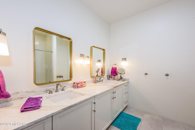 bathroom featuring tile patterned floors, vanity, and lofted ceiling