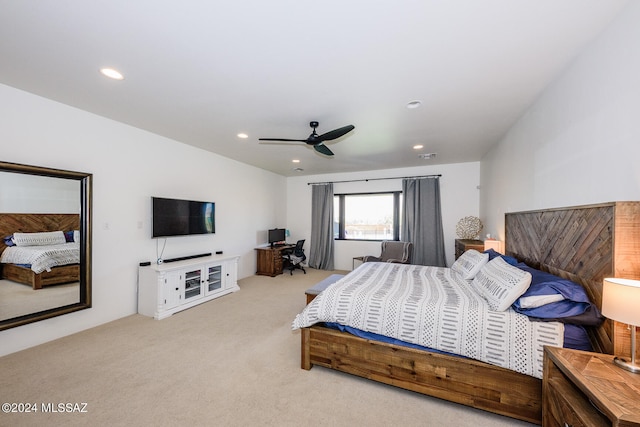 bedroom featuring light carpet and ceiling fan