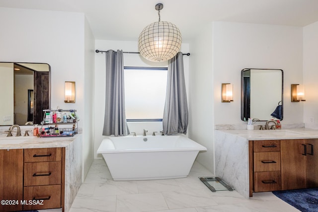 bathroom with a tub to relax in and vanity