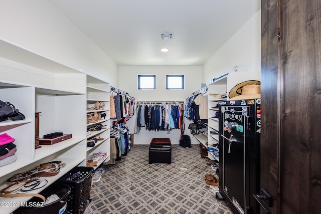 spacious closet featuring carpet floors