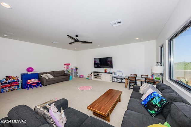 living room with carpet and ceiling fan