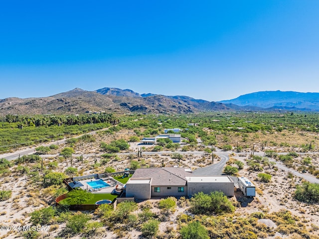 birds eye view of property featuring a mountain view