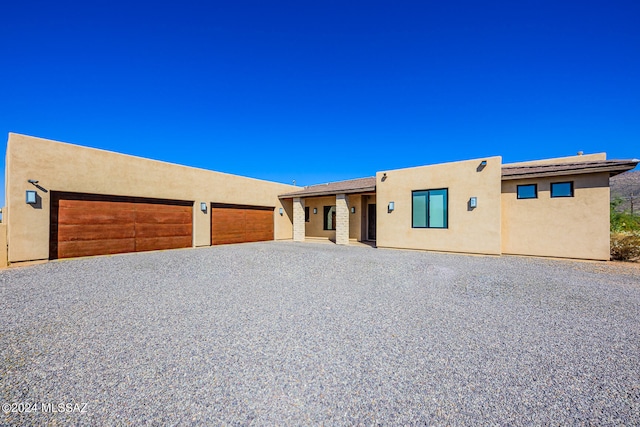 southwest-style home with a garage