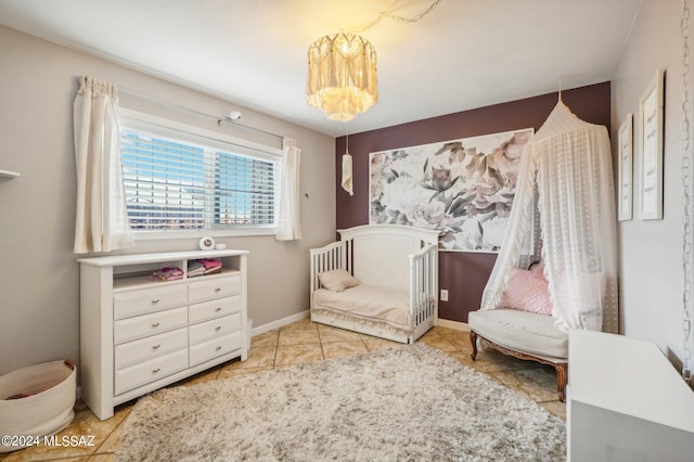 tiled bedroom featuring a chandelier