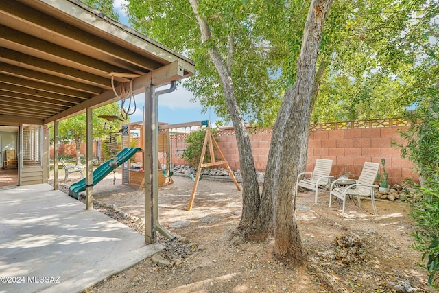 view of patio with a playground