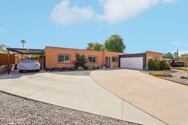 ranch-style home with a carport and a garage