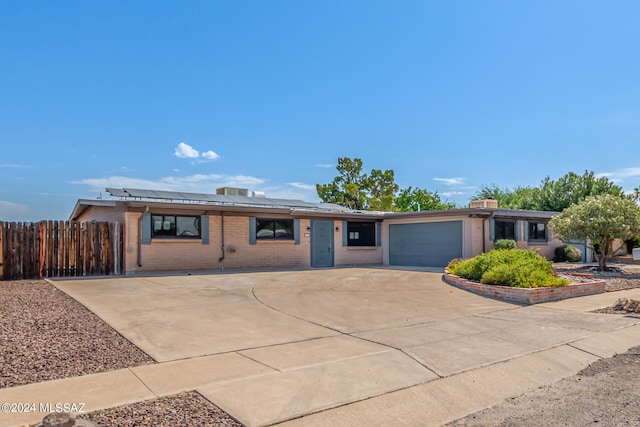 single story home featuring a garage