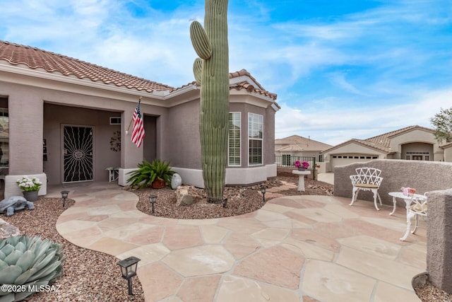 view of patio featuring a garage