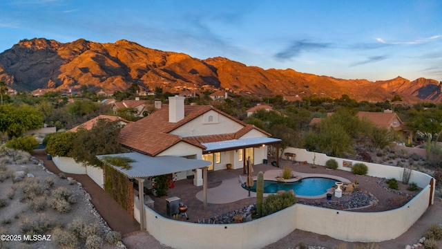 exterior space featuring a patio area and a mountain view