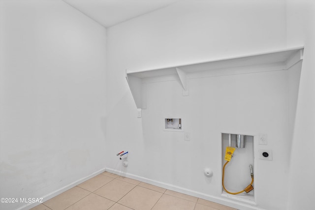 laundry room featuring washer hookup, hookup for an electric dryer, hookup for a gas dryer, and light tile patterned floors