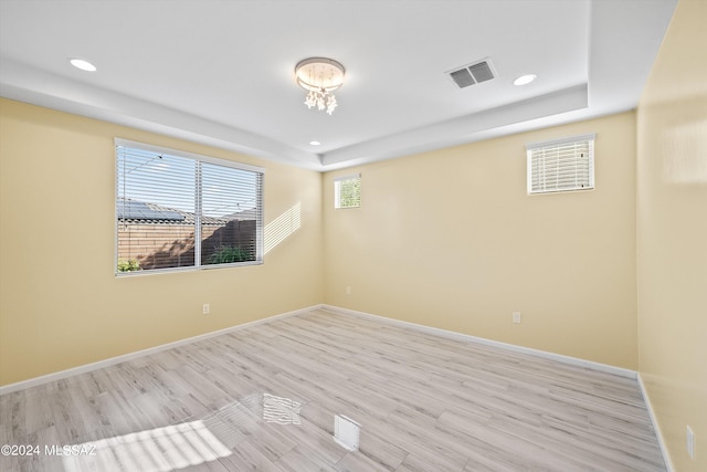 spare room with light hardwood / wood-style floors