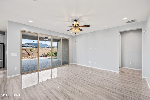 unfurnished room featuring ceiling fan and light hardwood / wood-style flooring