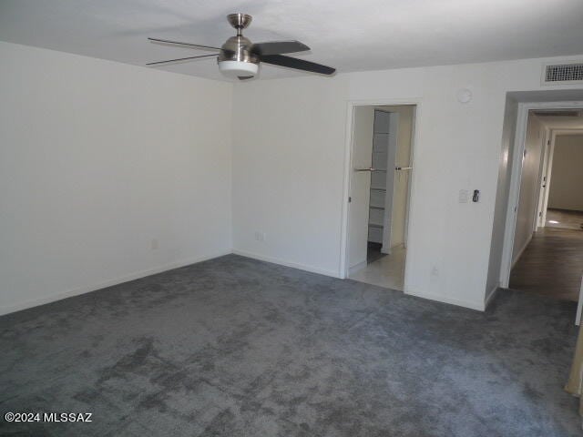 carpeted empty room with ceiling fan