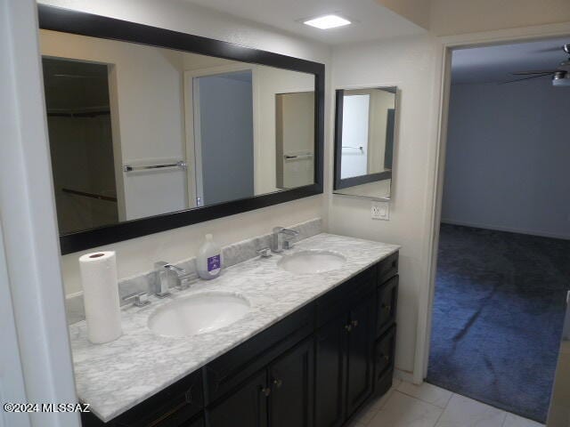 bathroom with ceiling fan and vanity