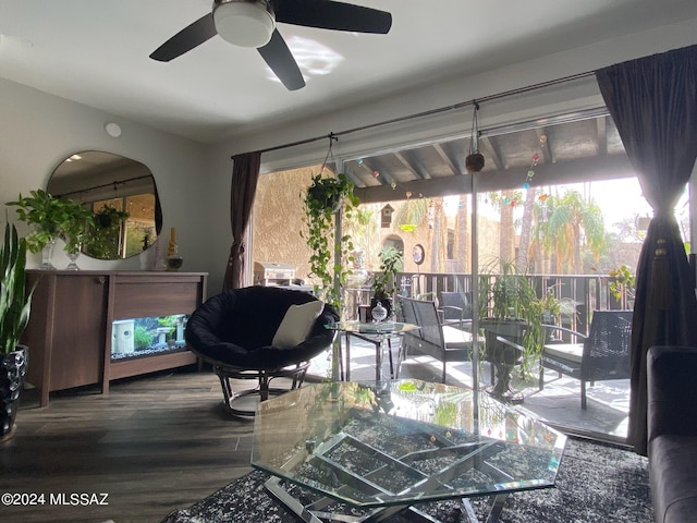 living room with ceiling fan and wood-type flooring