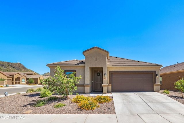 prairie-style home featuring a garage