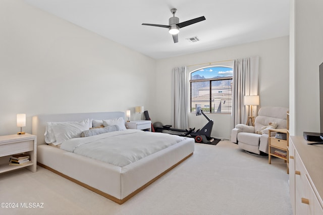 bedroom featuring ceiling fan and carpet