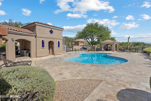 view of pool featuring a gazebo and a patio area