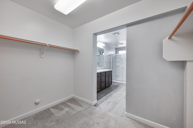 laundry room with light hardwood / wood-style flooring