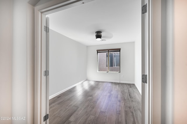 unfurnished room with hardwood / wood-style flooring