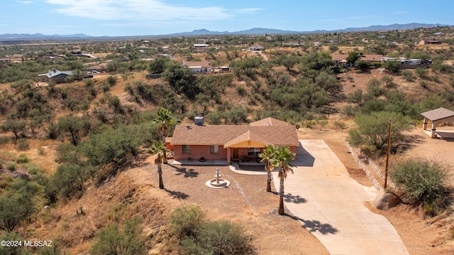 birds eye view of property featuring a mountain view