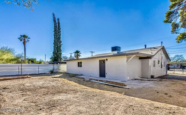 1738 N Cloverland Ave, Tucson, AZ 85712 - rear view of property featuring stucco siding and cooling unit
