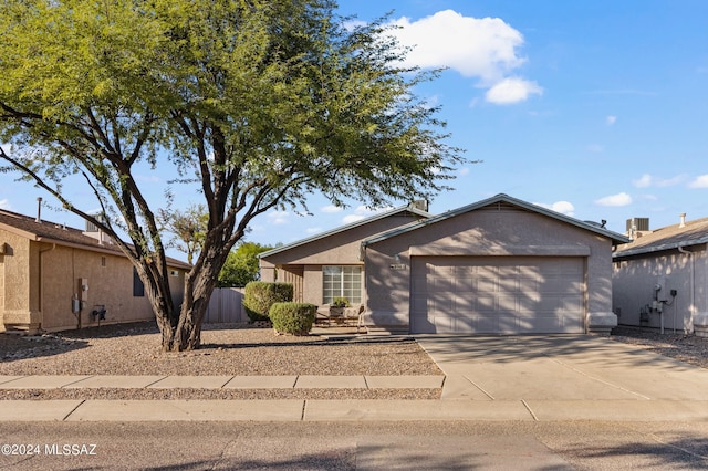 ranch-style home with a garage