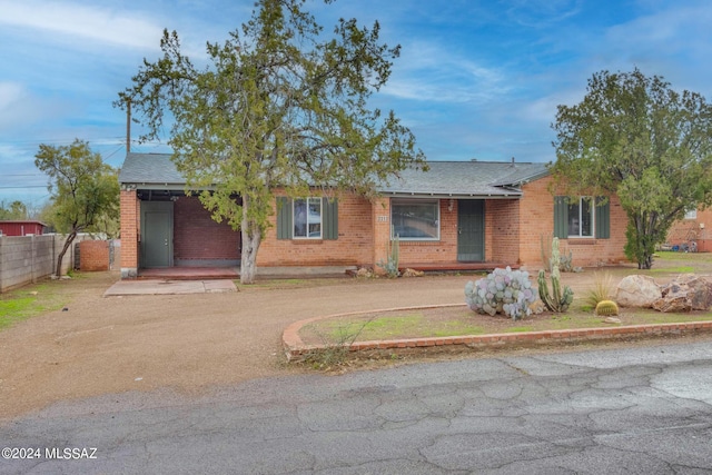 single story home with covered porch