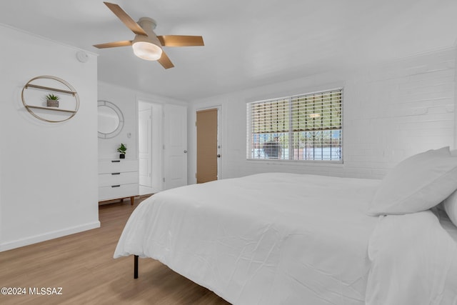 bedroom featuring ceiling fan and hardwood / wood-style floors