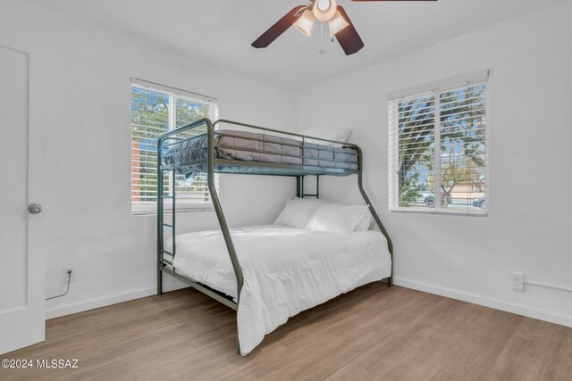 bedroom featuring ceiling fan and hardwood / wood-style flooring