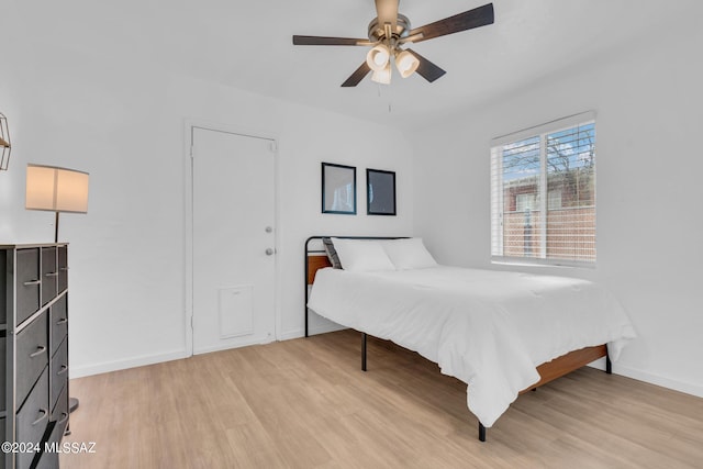 bedroom featuring light hardwood / wood-style flooring and ceiling fan