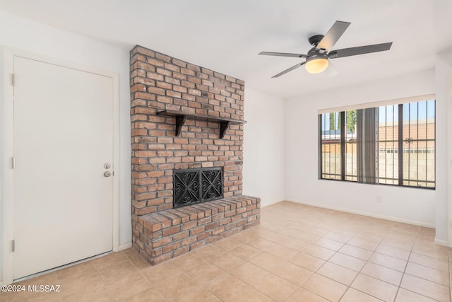 unfurnished living room with a fireplace, ceiling fan, and light tile patterned floors