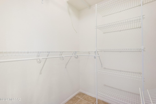 spacious closet featuring light tile patterned flooring